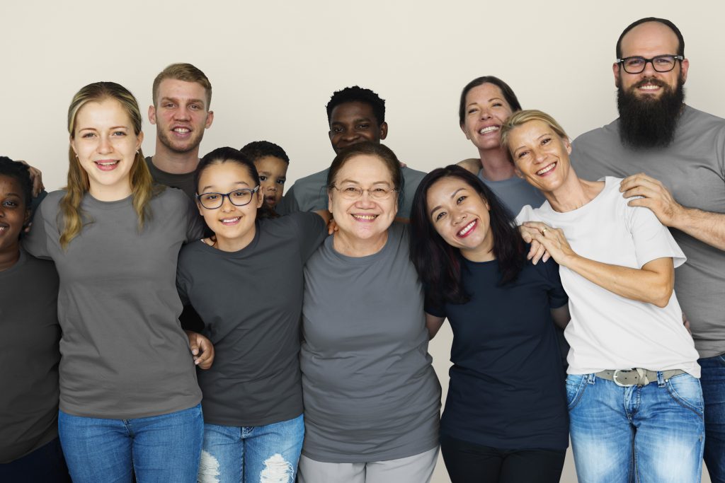 Diverse group of people holding hands in a display of unity and togetherness